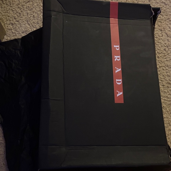 Prada Men's Bag in Black with Red Accent
